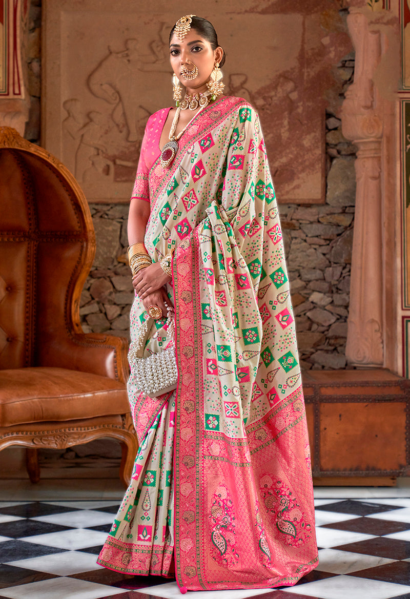 Traditional white Banarasi silk saree with intricate woven details.