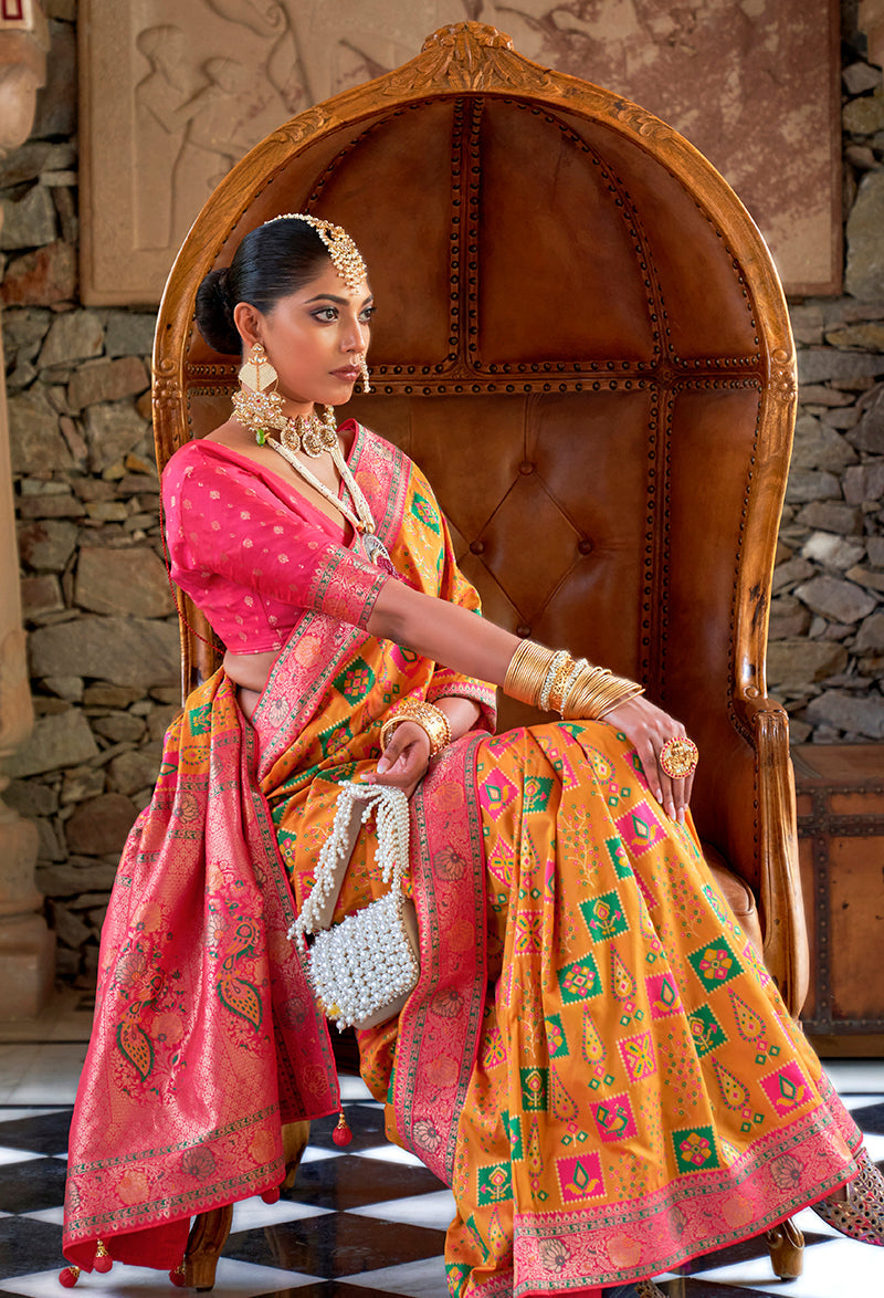 Mustard Banarasi silk saree with intricate gold Zari weaving.