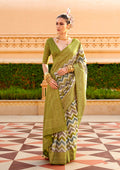 Sophisticated olive silk saree with intricate ethnic foil print details.