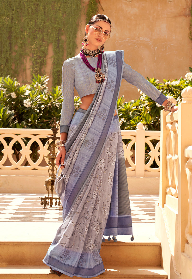 Grey raw silk saree with intricate foliage prints draped elegantly