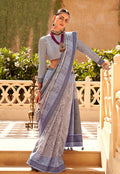 Grey raw silk saree with intricate foliage prints draped elegantly