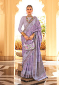 Close up of a lavender raw silk saree featuring intricate foil print detailing