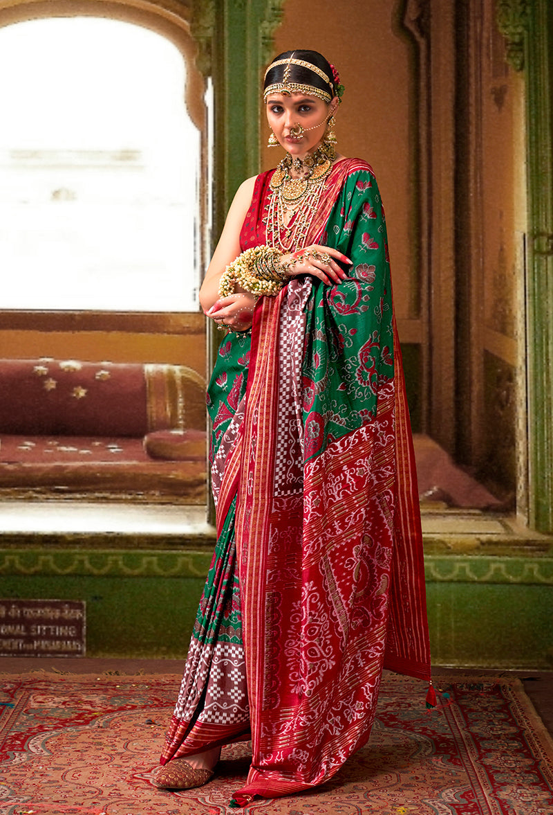 Elegant green silk saree with traditional Patola print patterns