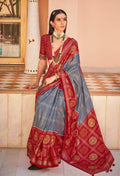 Grey silk saree with modern Patola and foil print detailing.