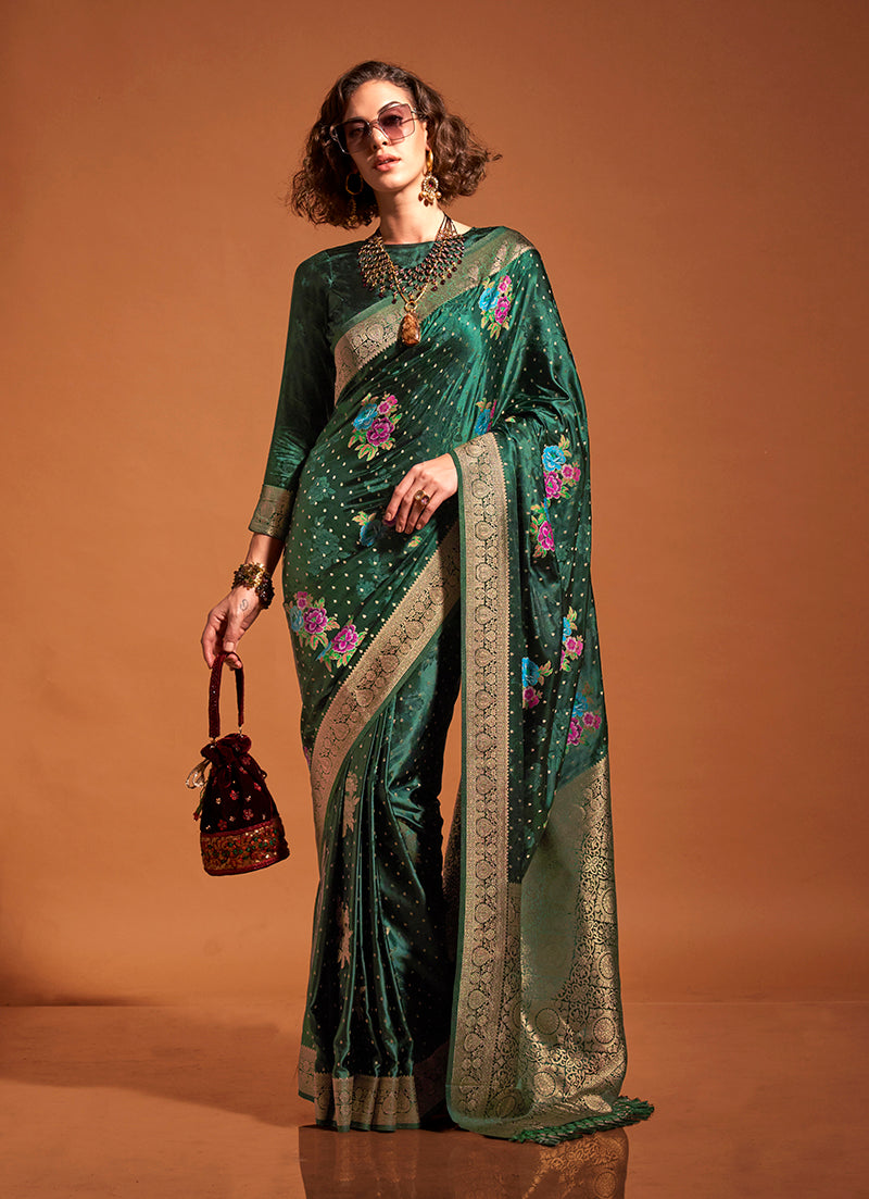 Model wearing a Dark Green Handloom Silk traditional saree with golden accents.