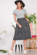 Sleeveless midi summer dress with side slits and round neckline