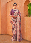 Woman wearing a multicolor silk saree with geometric foil print patterns and elegant drape.