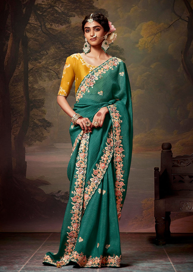 Elegant teal organza saree with intricate thread work embroidery detail