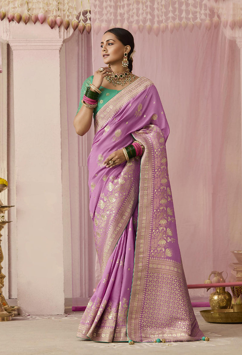 Mauve viscose saree with elegant floral prints and traditional weaving.