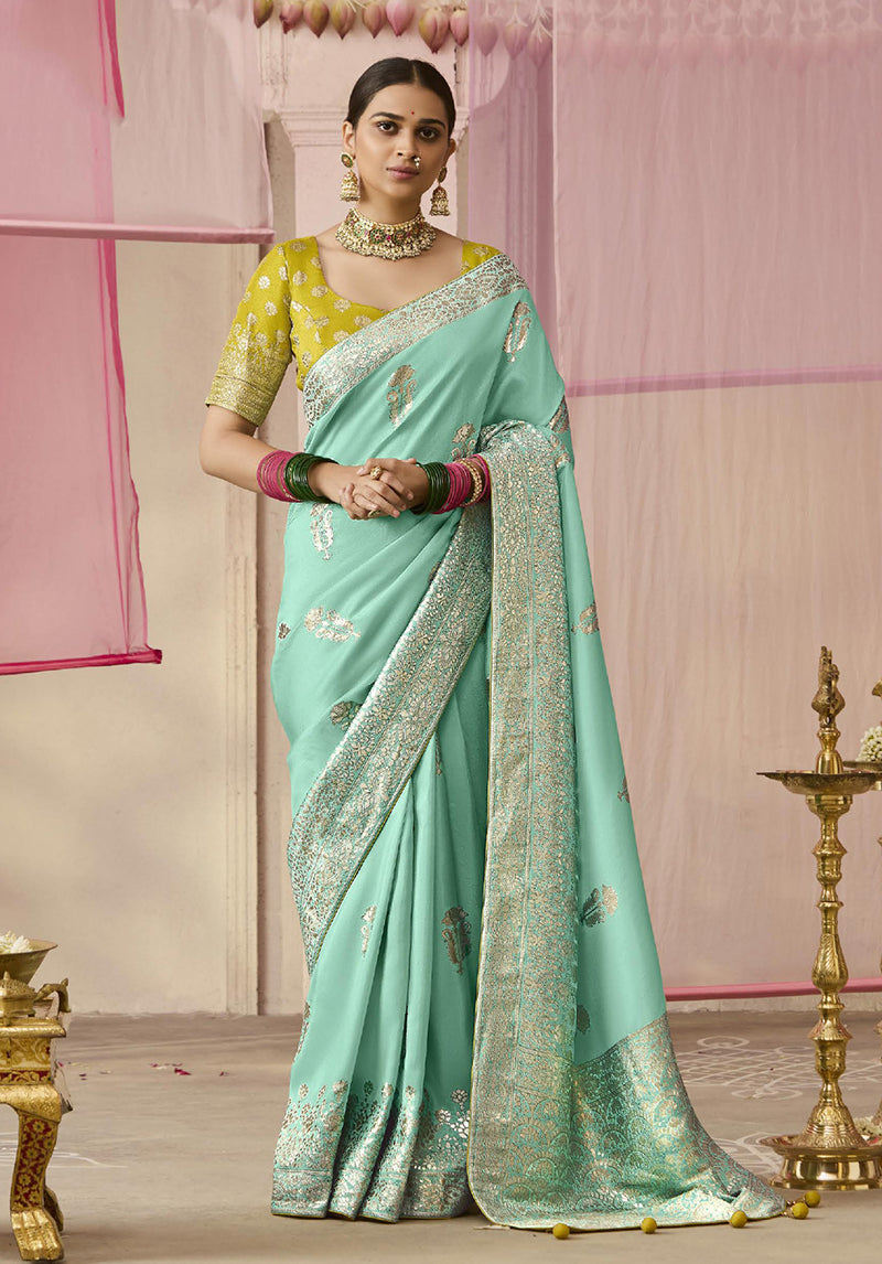 Aqua blue viscose saree with floral print and weaving details.