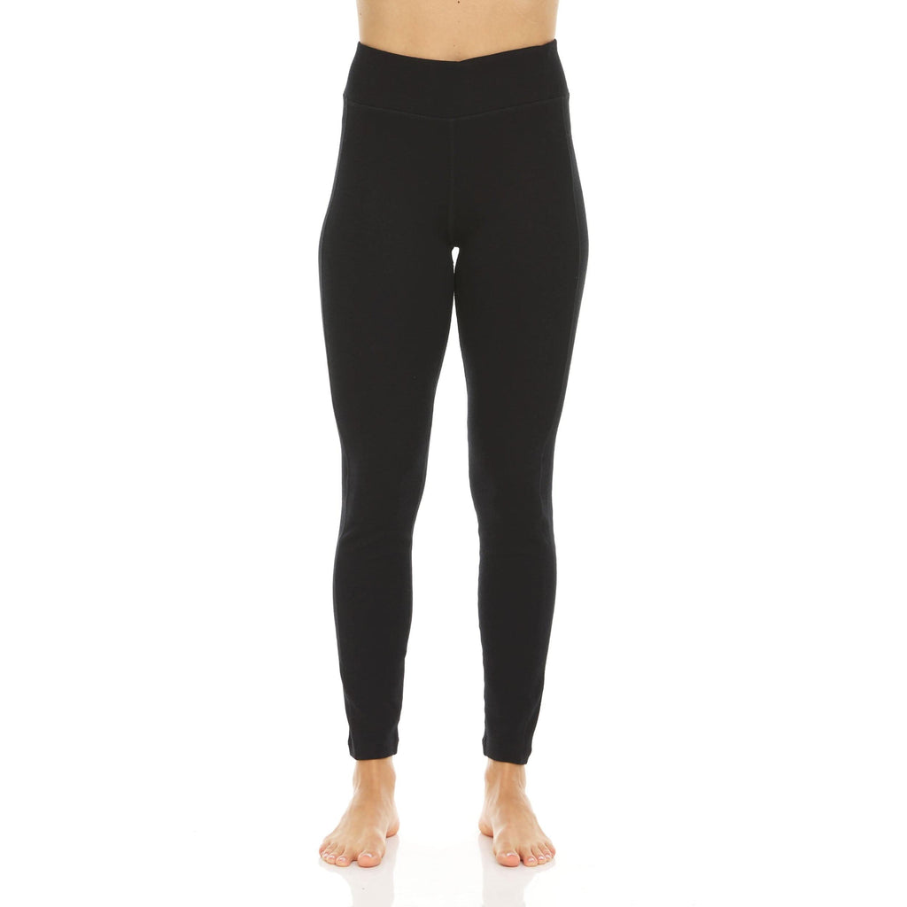 A pair of solid black, high-rise Woolverino microweight merino wool leggings with a tapered, fitted silhouette.