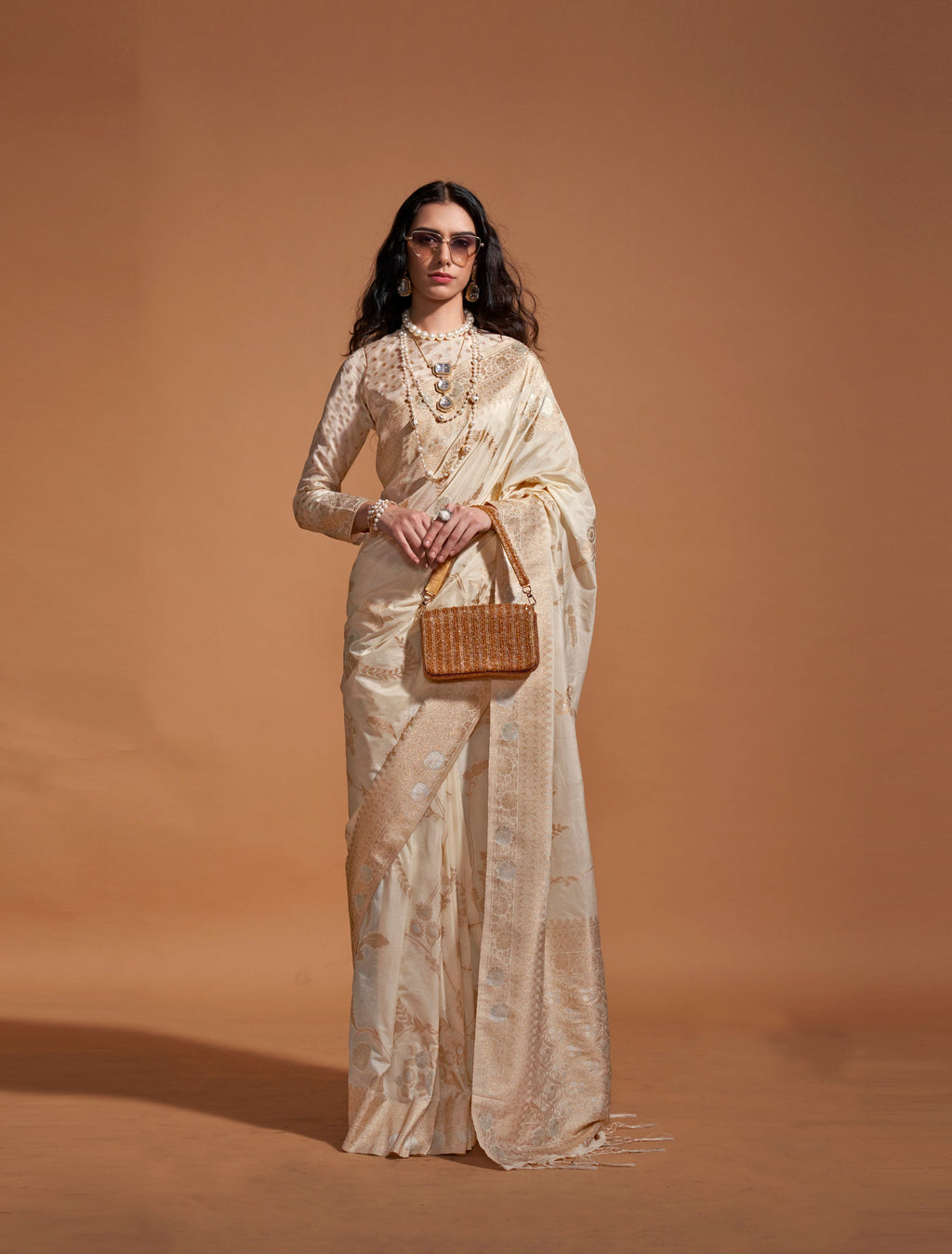 Traditional Cream Silk saree with intricate weaving details