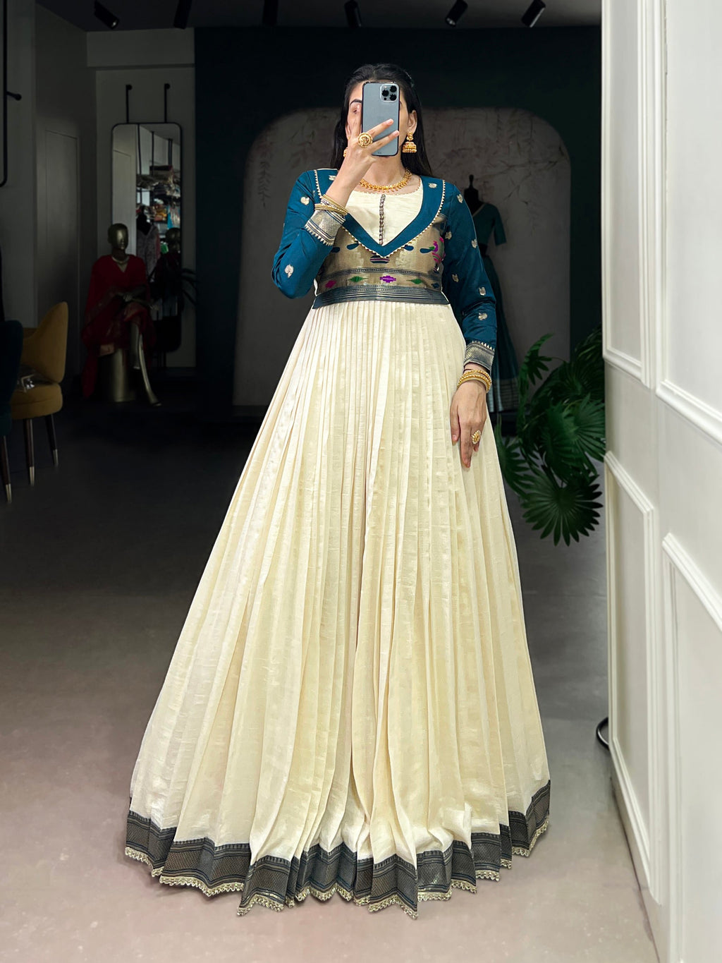 Off white Vichitra silk gown with intricate Zari weaving and lace detailing