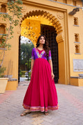 Pink Vichitra silk long dress featuring intricate zari weaving and delicate lace trim.