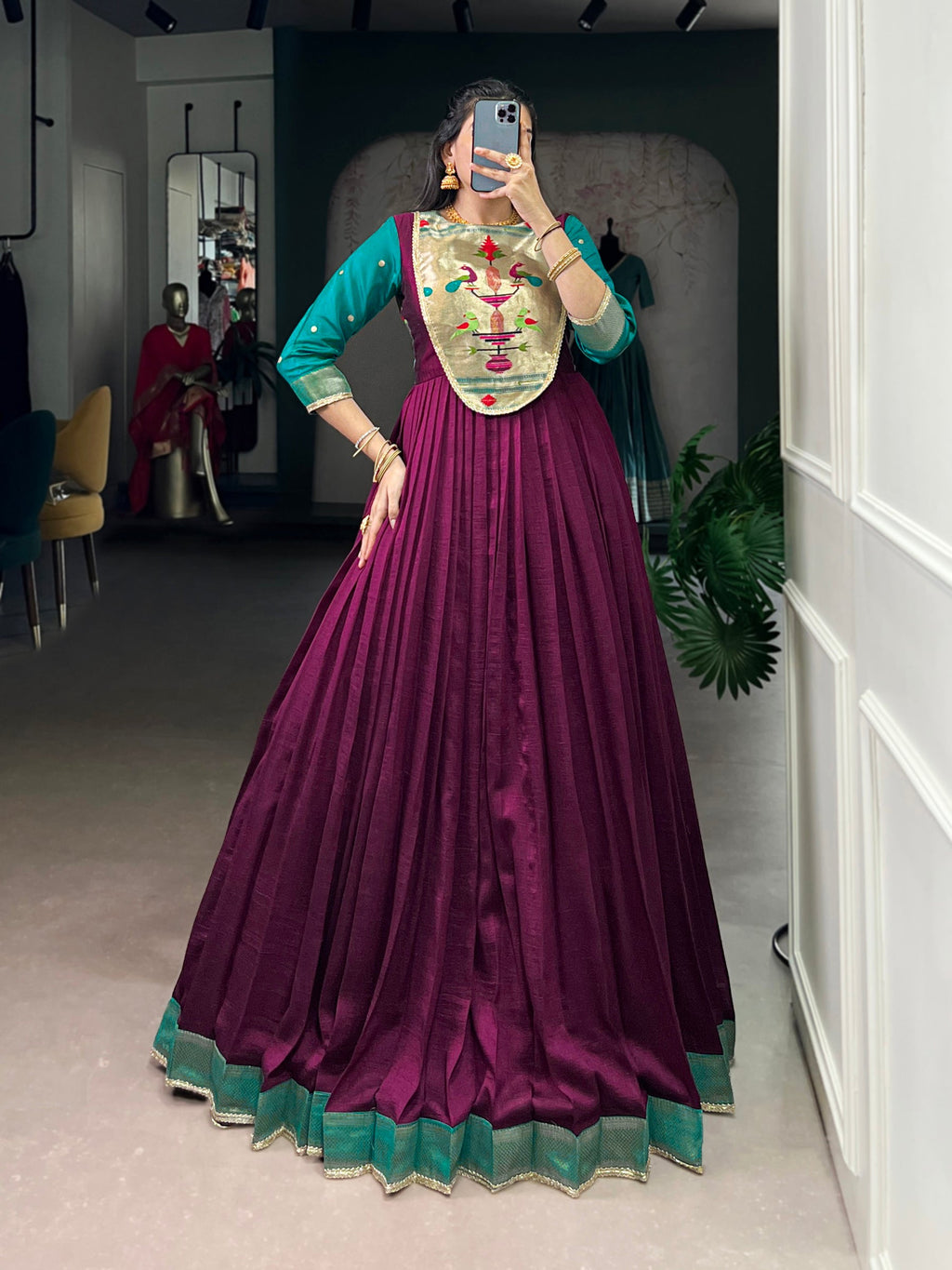 Wine-colored Vichitra silk gown with Zari weaving and lace accents