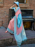 A light blue and peach silk saree with intricate festival weaving patterns
