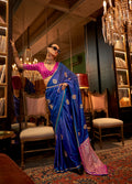 Royal blue satin saree with detailed weaving work for formal occasions