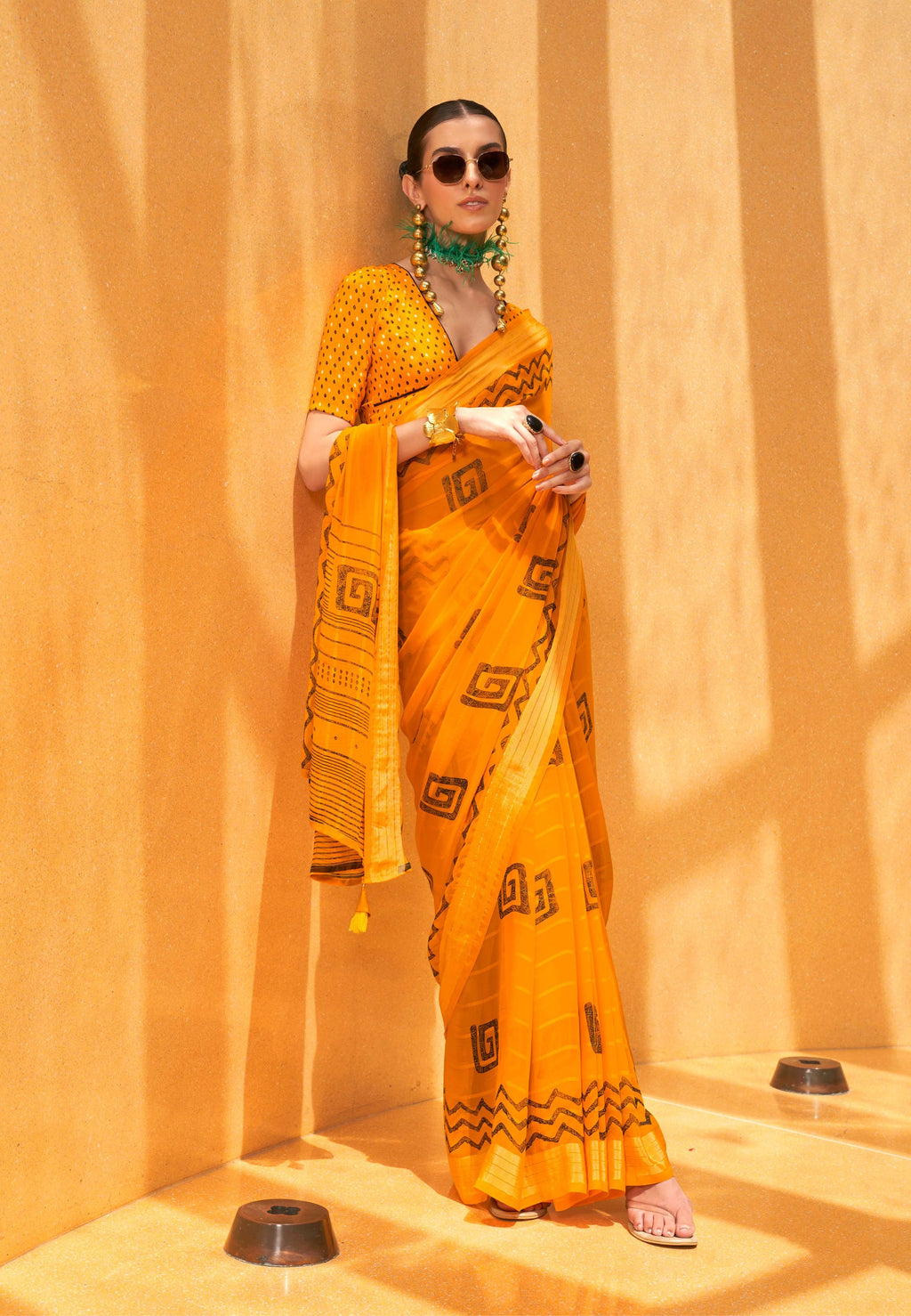 Beautiful yellow georgette saree with vibrant ethnic print details