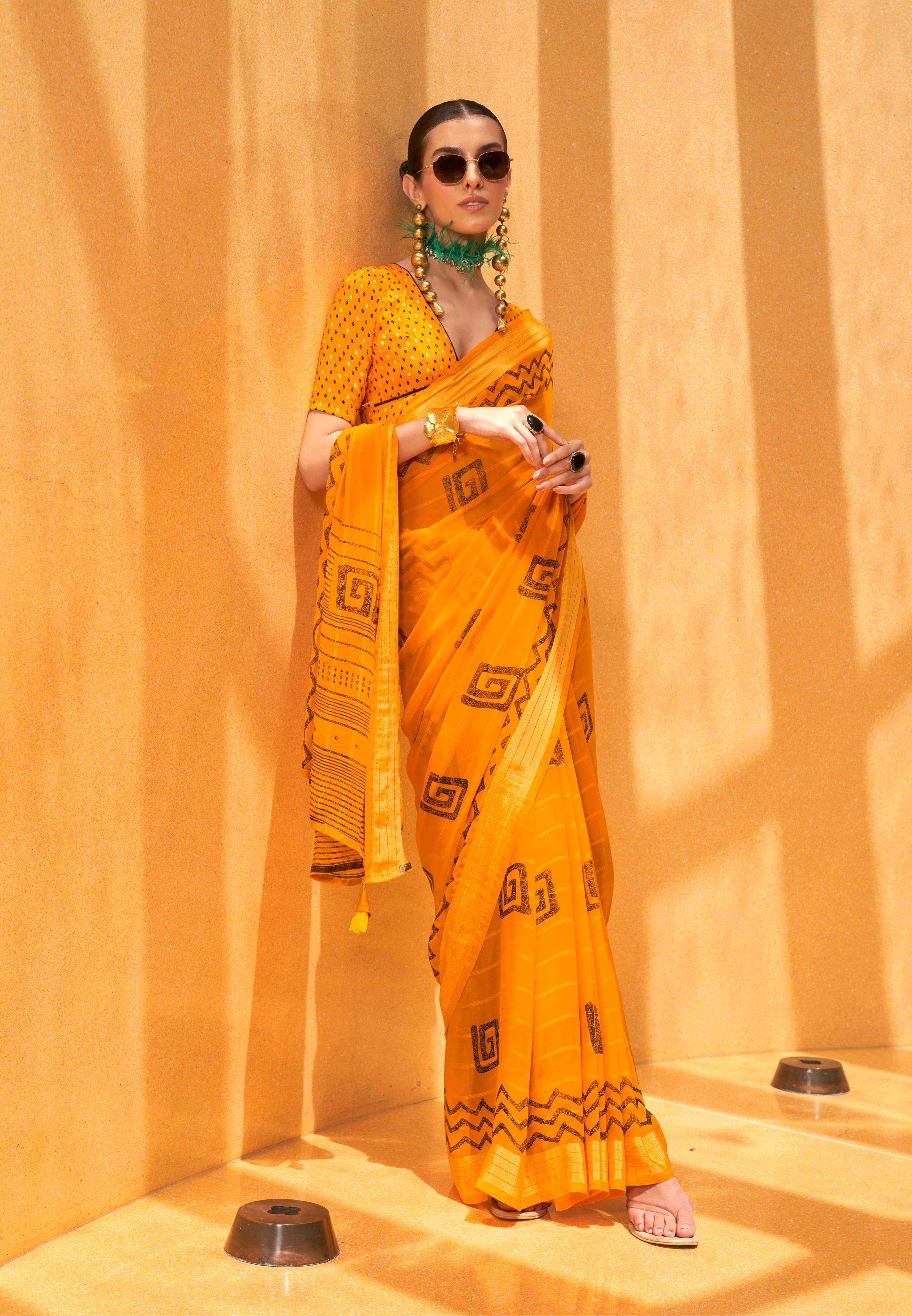 Beautiful yellow georgette saree with vibrant ethnic print details
