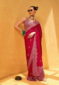 Hot pink georgette contemporary printed saree draped on a model