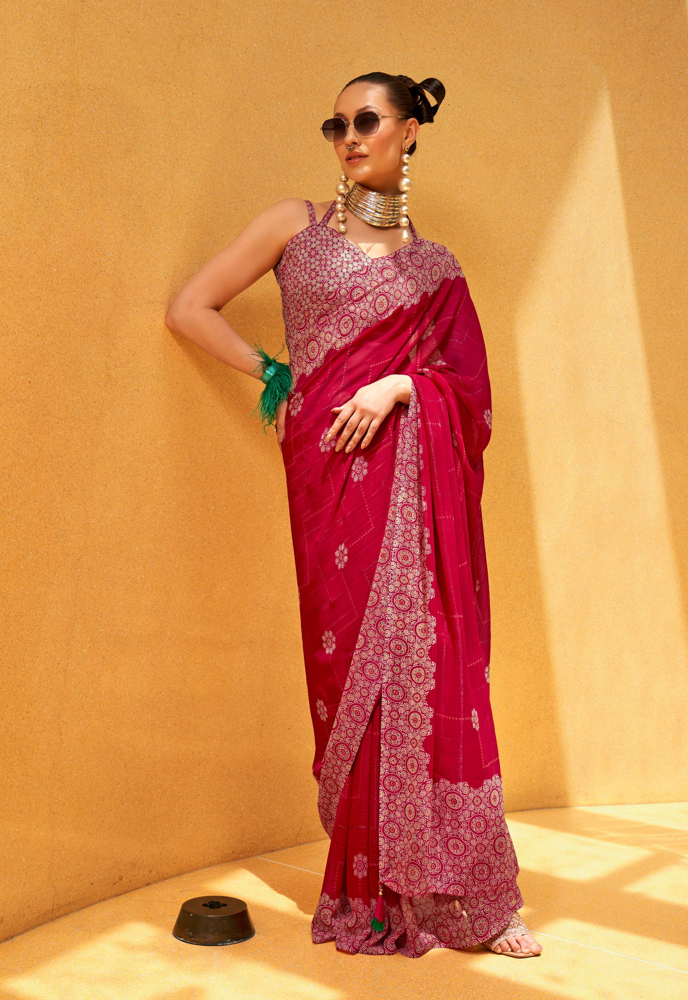 Hot pink georgette contemporary printed saree draped on a model