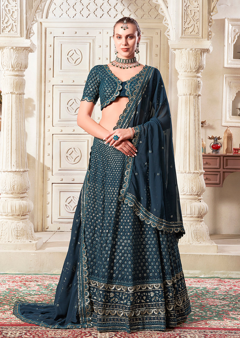 Dark teal georgette lehenga choli with decorative embroidery and sequins