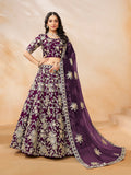 Model wearing a purple embroidered art silk lehenga choli with ornate detailing