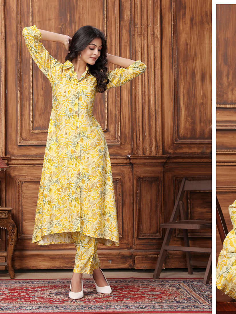 Yellow long kurta and pant set with elegant floral print in premium rayon fabric.