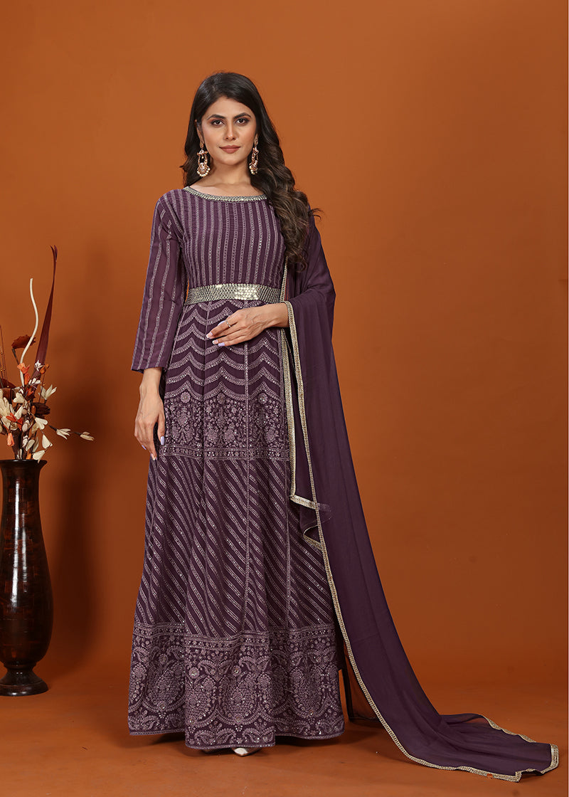 Elegant wine-colored faux georgette readymade gown with detailed embroidery.