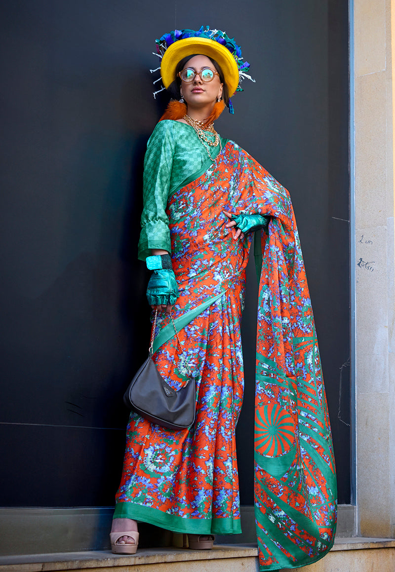 A beautiful salmon colour printed satin saree with intricate patterns and a classic drape.
