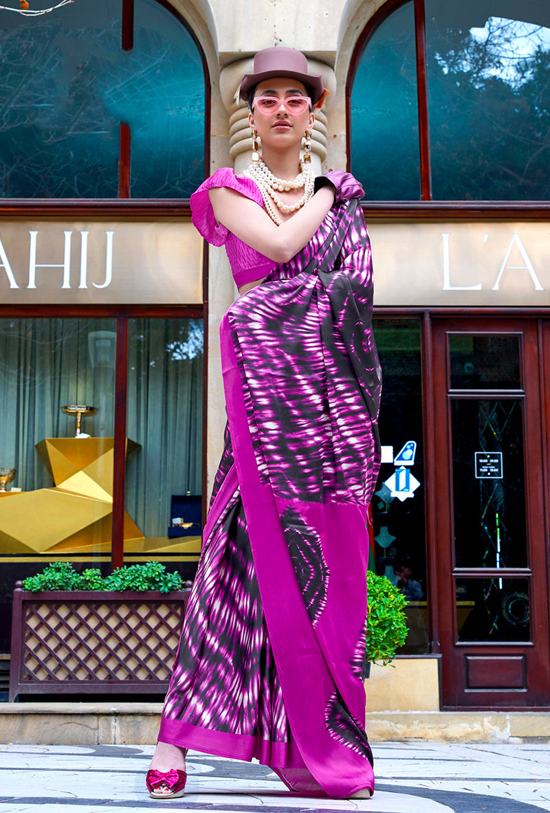 A stylish magenta satin saree with beautiful print work throughout.