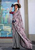 Close-up of a multi-colour printed satin saree showing vibrant patterns.