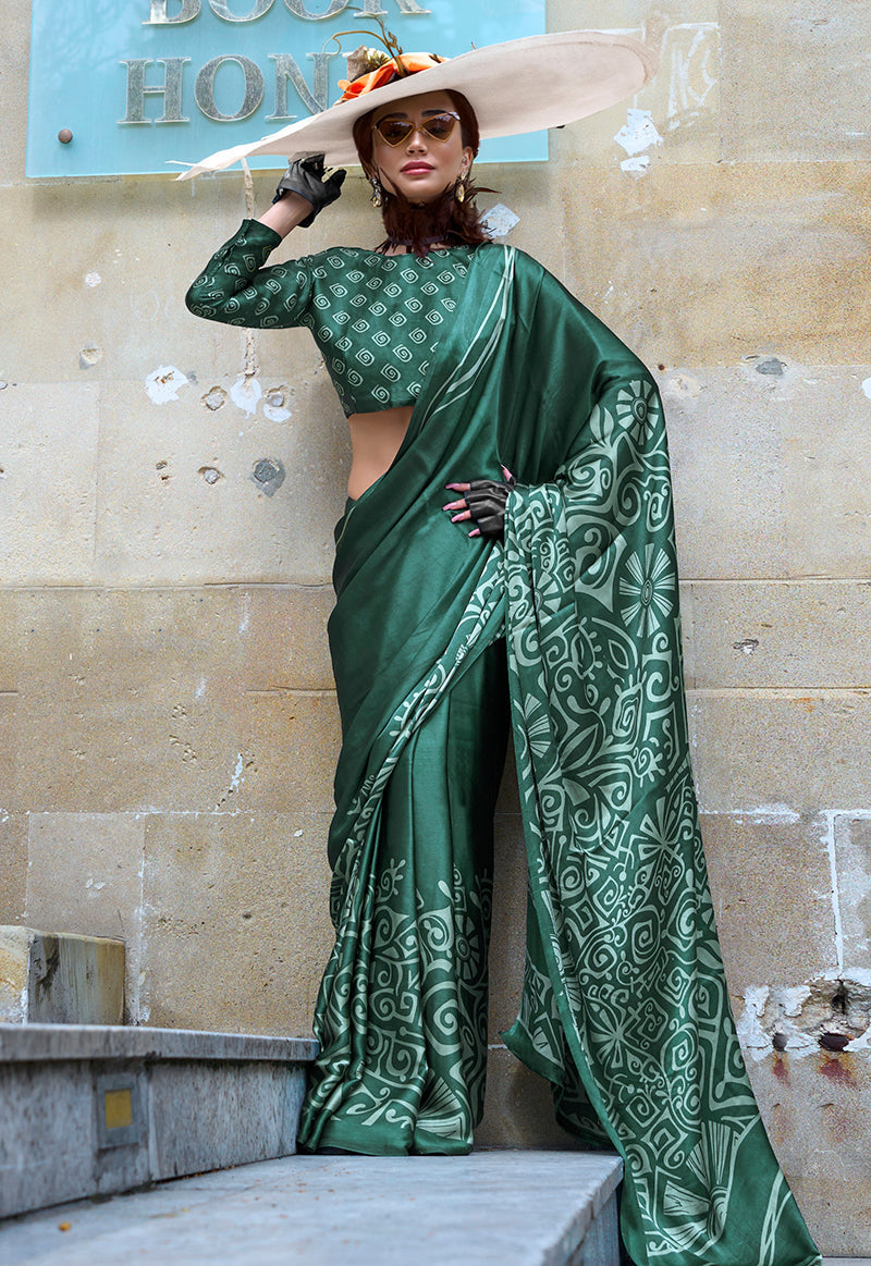 Dark green printed satin saree featuring elegant patterns