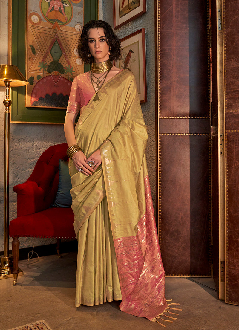 A traditional golden Tussar silk saree featuring elaborate woven patterns.