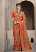 Orange silk traditional saree with intricate patola print pattern