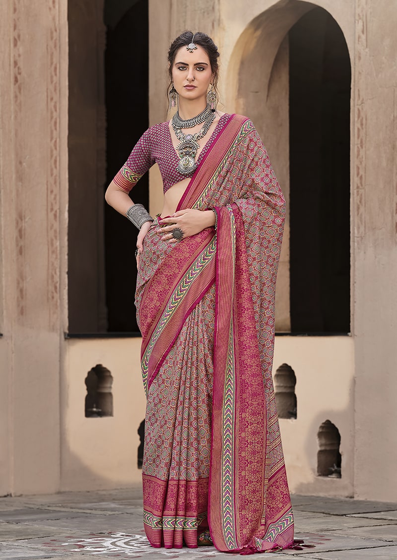 Traditional maroon silk saree featuring intricate patola print