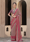 Traditional maroon silk saree featuring intricate patola print