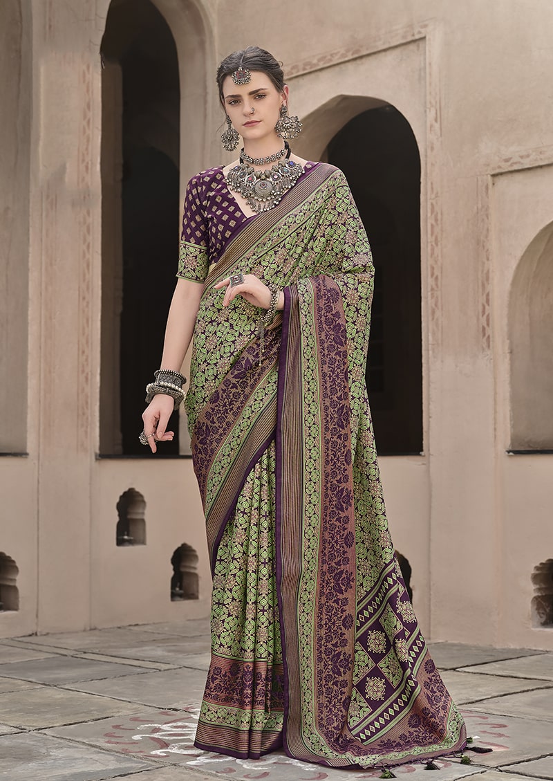 Traditional green silk saree with intricate patola print pattern