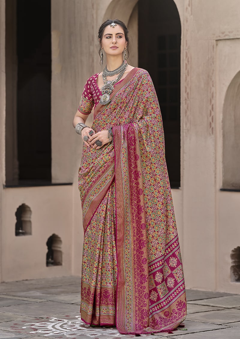 Rani Pink traditional silk saree with detailed patola print patterns.