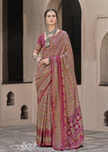 Rani Pink traditional silk saree with detailed patola print patterns.