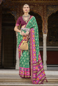 Light green and pink silk saree with detailed patola print