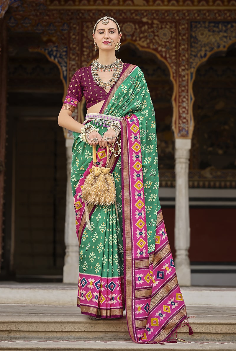 Light green and pink silk saree with detailed patola print