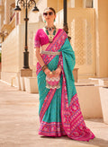 Turquoise and rani pink Patola print silk saree with traditional geometric patterns
