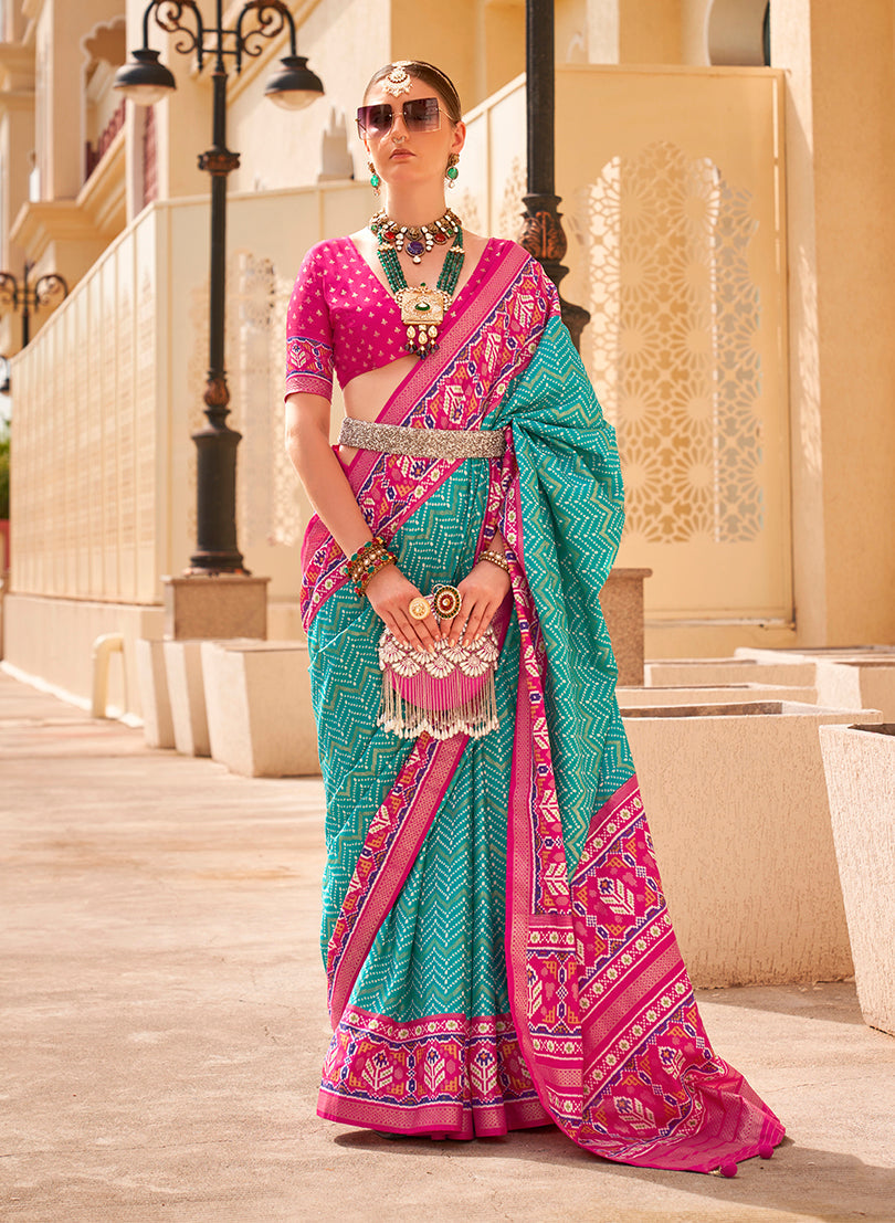 Turquoise and rani pink Patola print silk saree with traditional geometric patterns