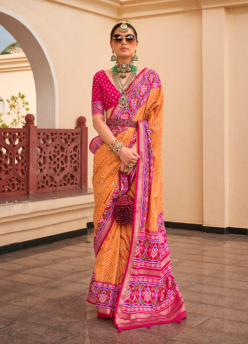 Mustard and rani pink Patola print silk saree with vibrant geometric designs