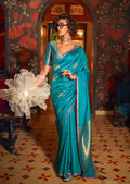 An elegant aqua blue handloom silk saree featuring detailed traditional weaving.