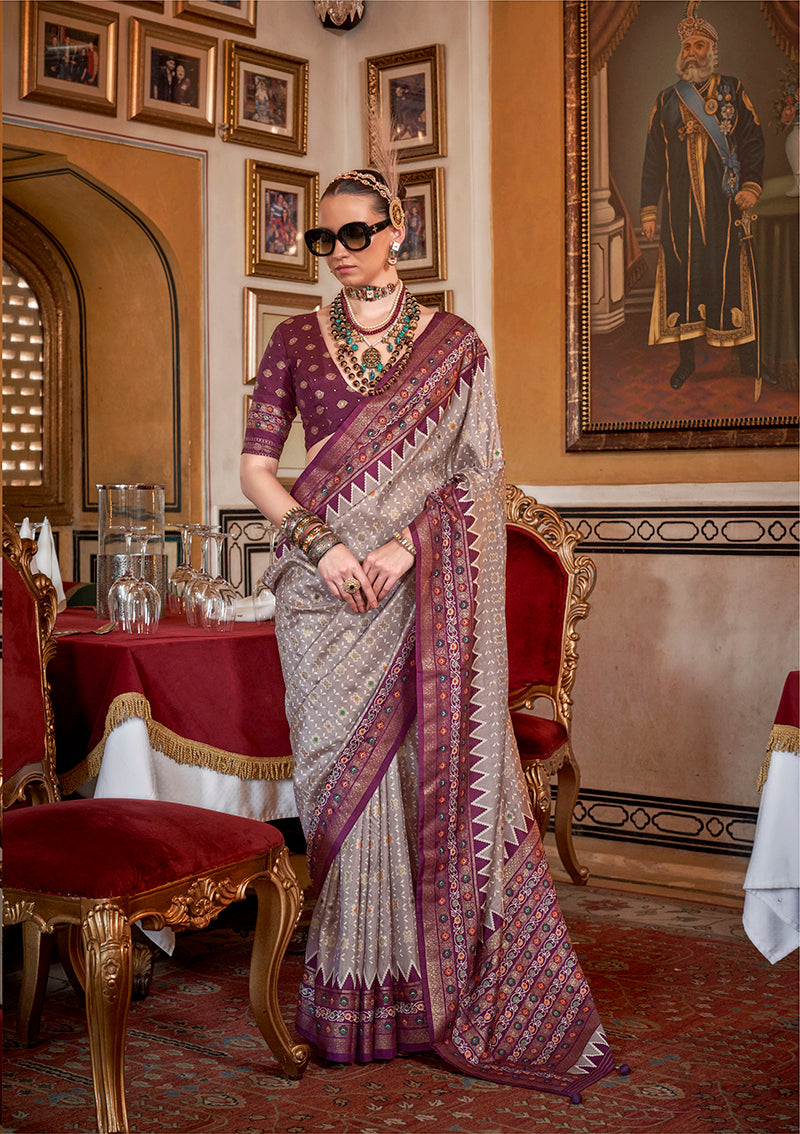 Grey silk saree with wine border and decorative prints