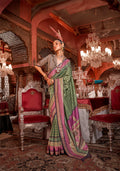 A traditional green silk saree with gold zari weaving patterns.