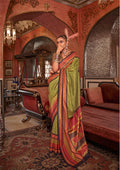 Light green traditional silk saree featuring detailed gold zari weaving and elegant drape.