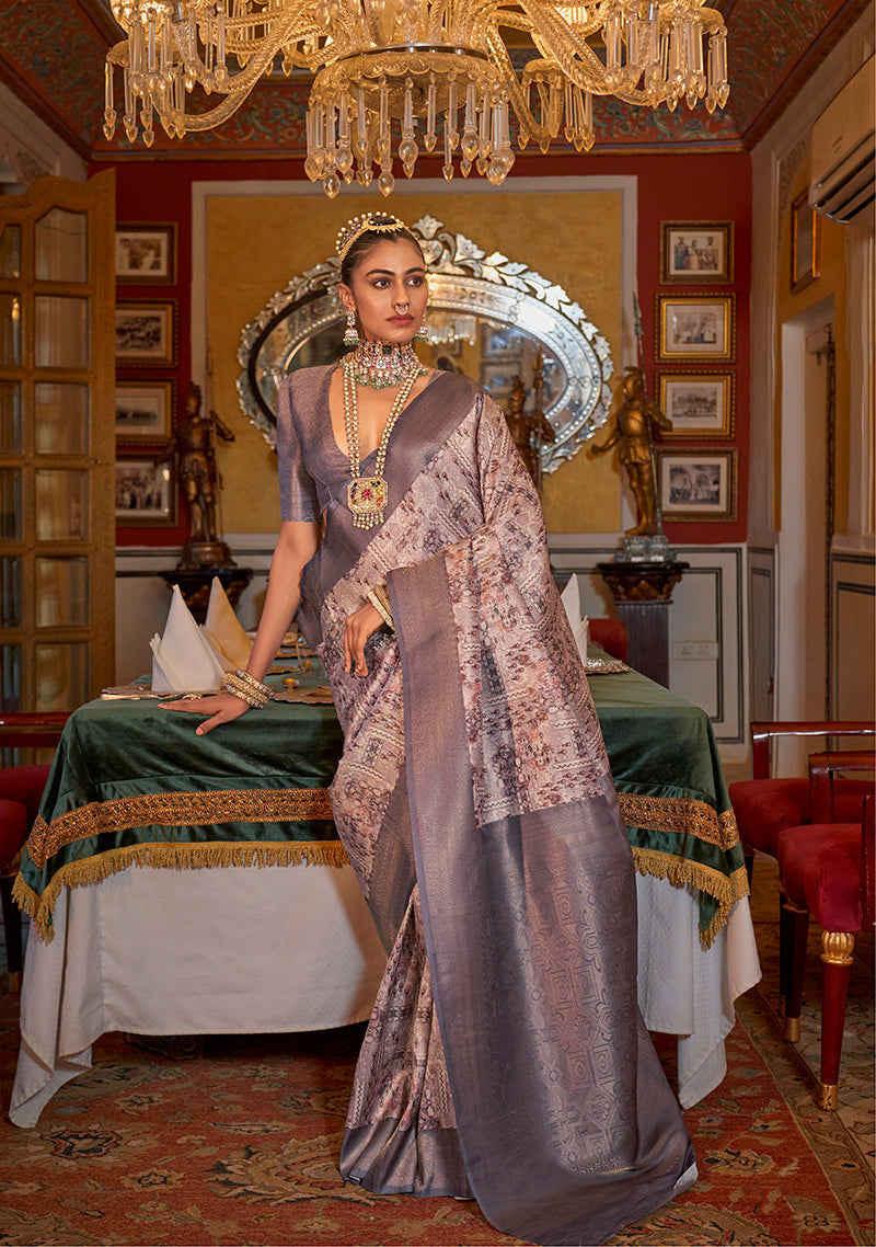 Purple Tussar silk saree featuring a digital print pattern and a shimmering zari border.